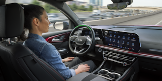 Woman in Front Drivers Seat of Traverse