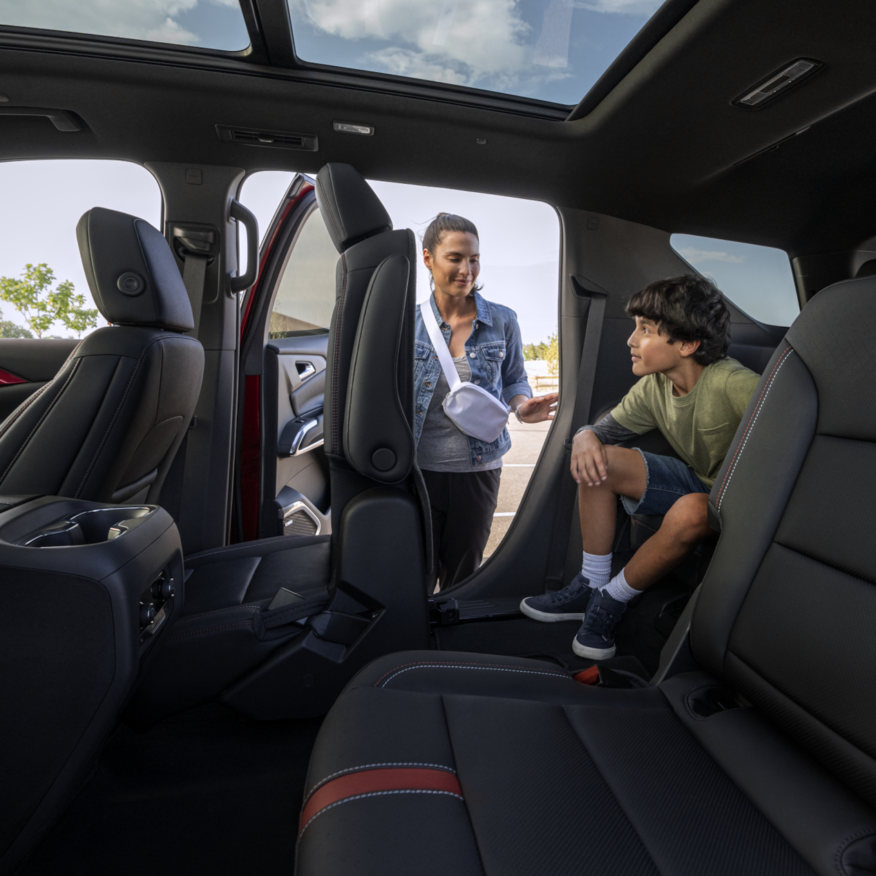 Mother Helping Son out of Back Seat