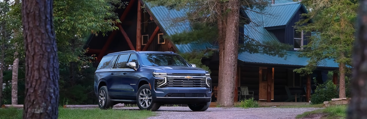 A Chevy SUV Parked outside a house in the Country