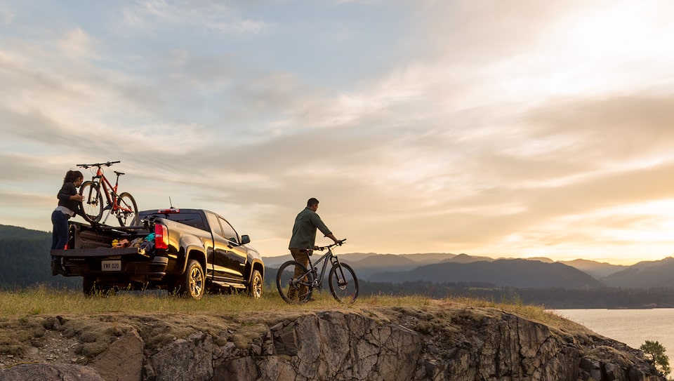 Couple Biking in Nature with their Chevrolet Silverado Truck