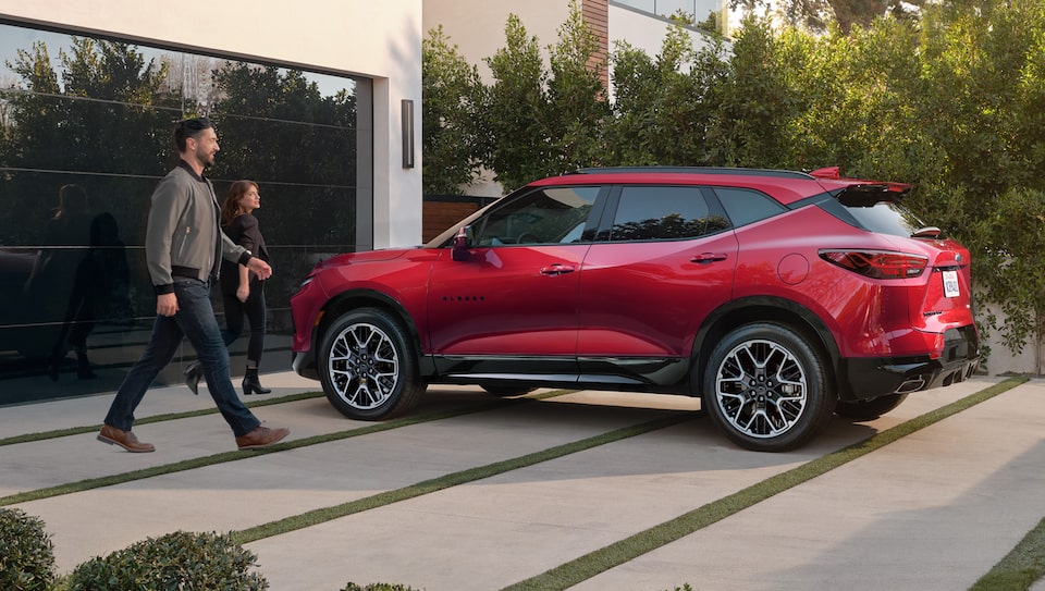 Couple Walking to Chevrolet Blazer SUV after Shopping with Rewards