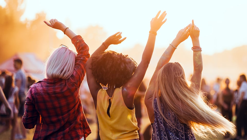 Women Dancing at Summer Outdoor Concert Festival When Using My Chevrolet Rewards