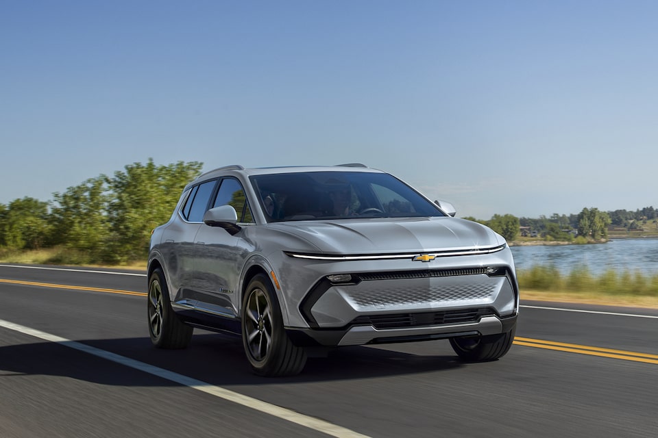 Chevrolet 2025 Equinox EV Driving Past Body of Water