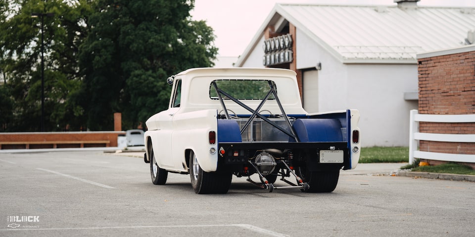 The truck features a drag racing setup.