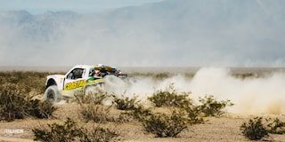 Rear Three-Quarters View of Jake Velasco's Off-Roading Truck Driving in the Desert