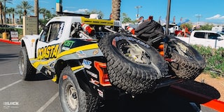 Close-up Rear Three-Quarters View of Jake Velasco's Off-Roading Truck Parked in a Parking Lot